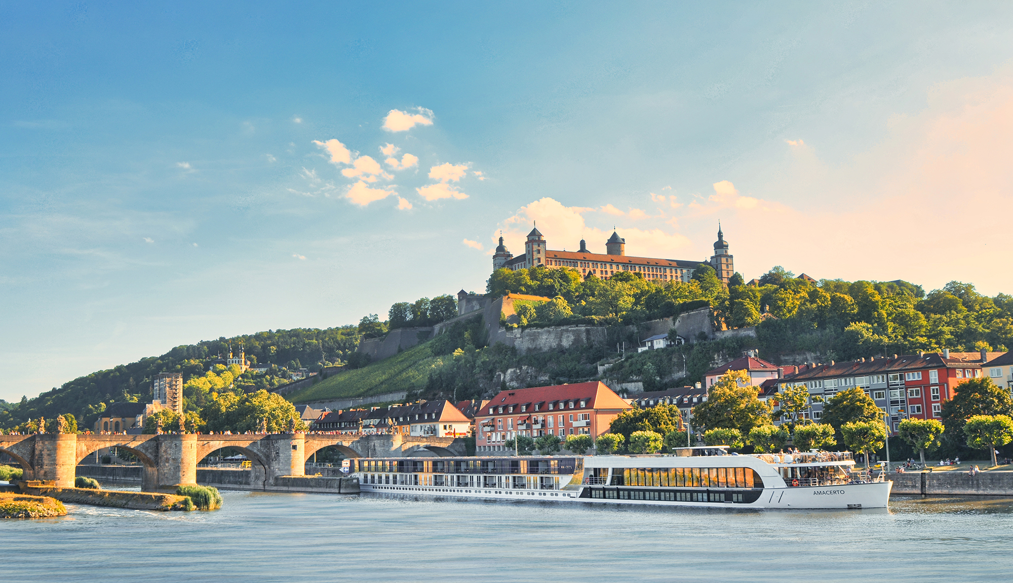 Amawateways river cruise ship on the main river in Wurzburg, Germany with castle in the background